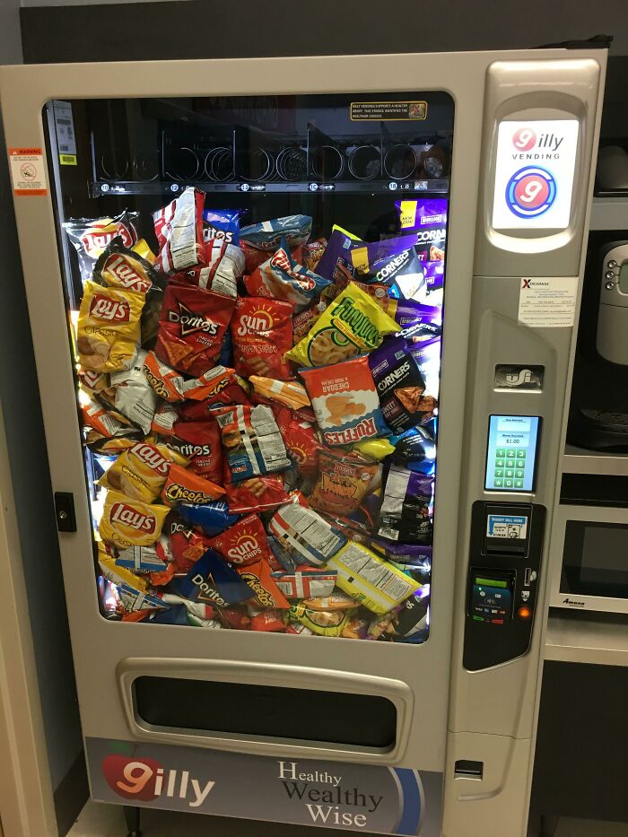 Vending machine packed with colorful snack bags for an intriguing visual experience.