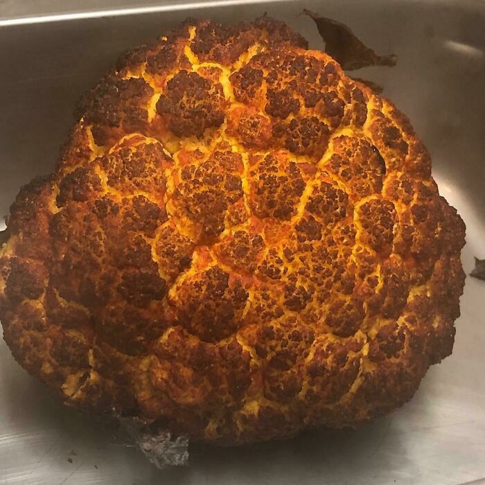 Burnt cauliflower resembling a planet, creating a fascinating visual effect.