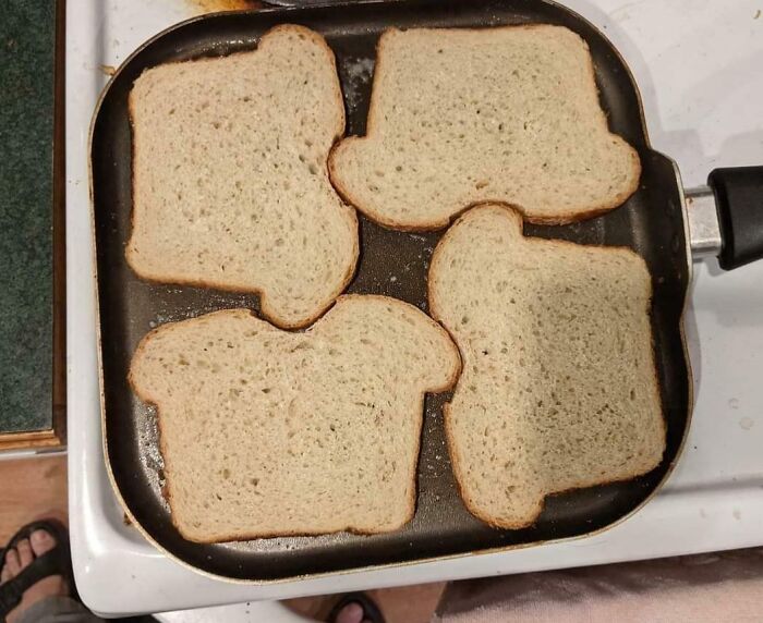 Slices of bread perfectly fit on a square pan, illustrating a satisfying perfect fit.