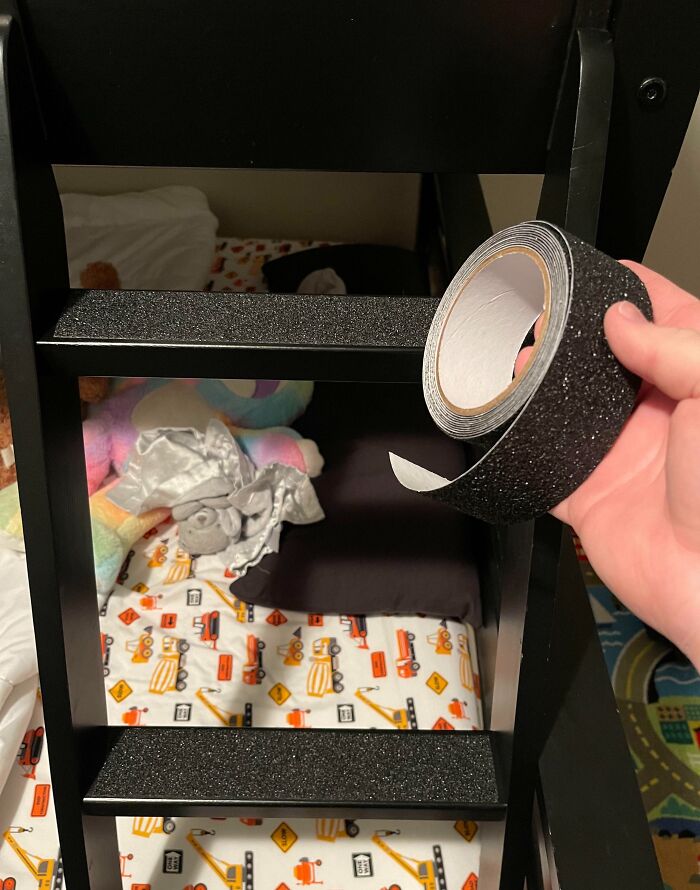 Non-slip tape applied to a bunk bed ladder, showcasing a parenting genius trick for added safety.