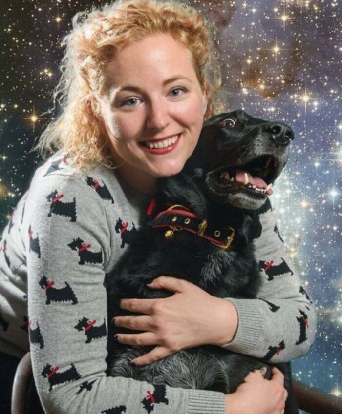 Woman with curly hair hugging a dog, both smiling against a starry backdrop, representing a funny viral family photo.