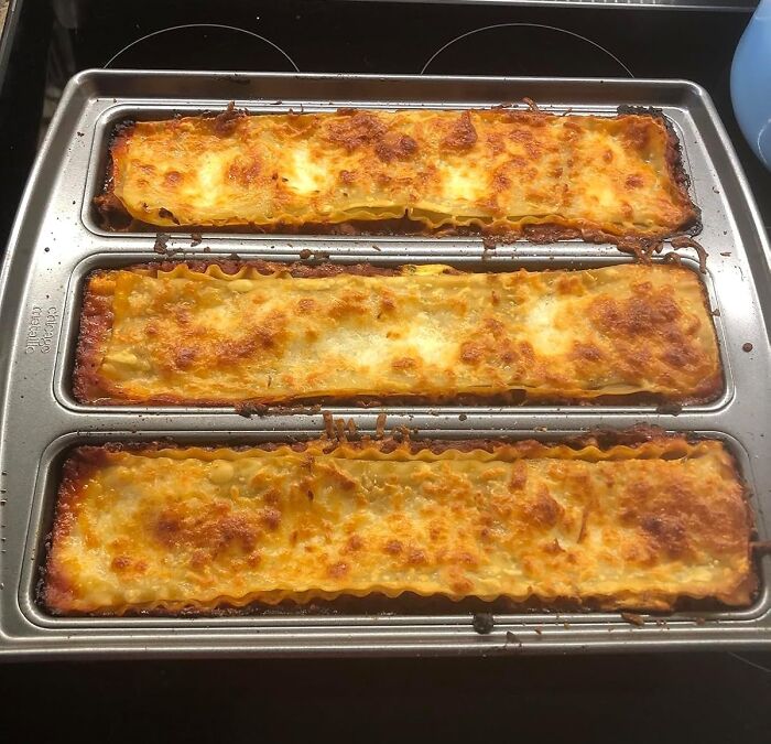 Freshly baked lasagna in a baking tray; perfect gifts for your mom.