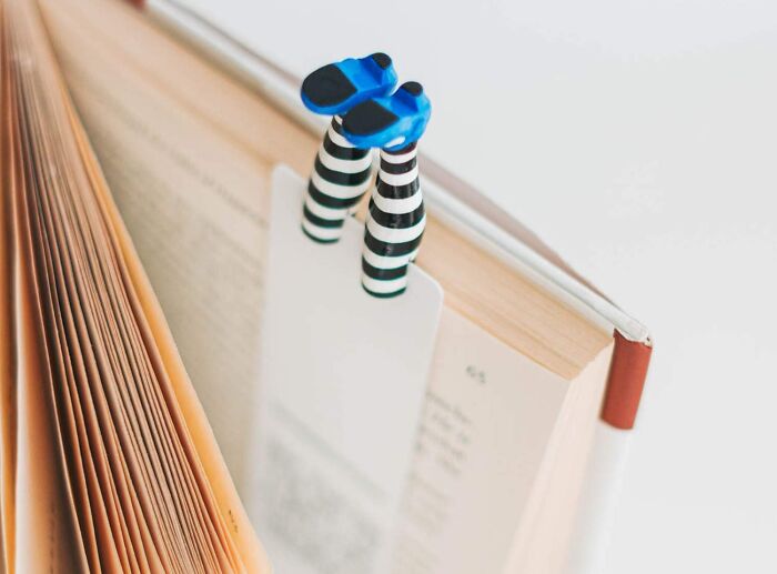 Quirky bookmark in a book with striped legs and blue shoes, ideal gifts for your mom.