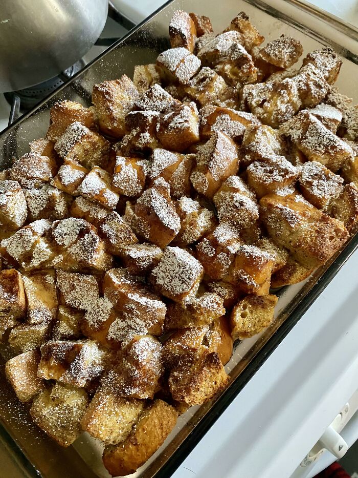 Baked bread pudding dusted with powdered sugar, a delicious Christmas snack idea.