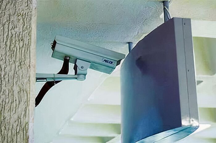 Security camera obstructed by a wall, highlighting an engineer's oversight.