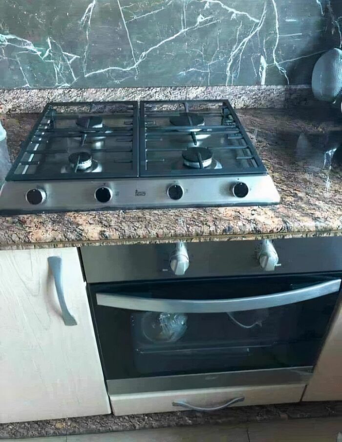 Gas stove installed incorrectly over an oven, showing a common engineering mistake.