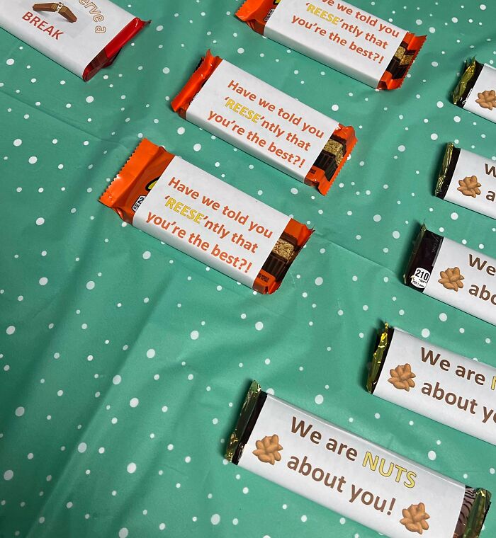 Assorted candy bars on a teal polka dot background, featuring playful puns.