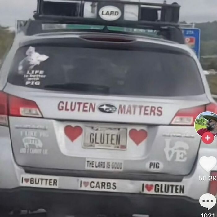 Car with "Gluten Matters" decals and stickers featuring hearts, a pig, and humorous quotes, showcasing cursed image humor.