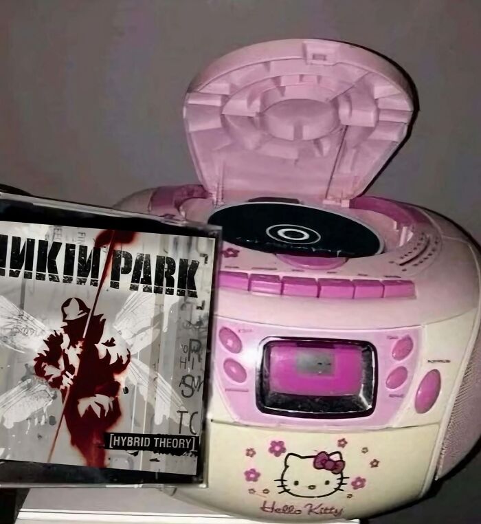 Cursed image: Hello Kitty CD player open with Linkin Park album.