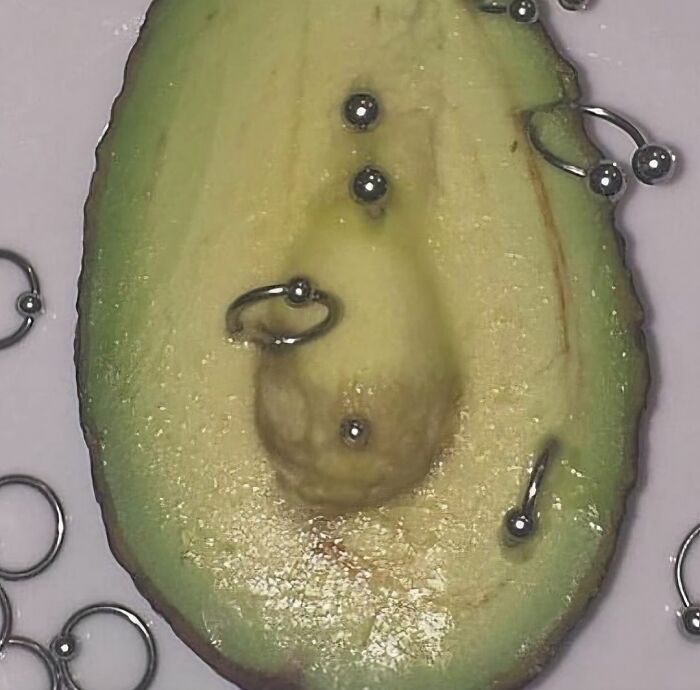 Avocado with piercings, a cursed image from a popular IG page known for disturbing content.