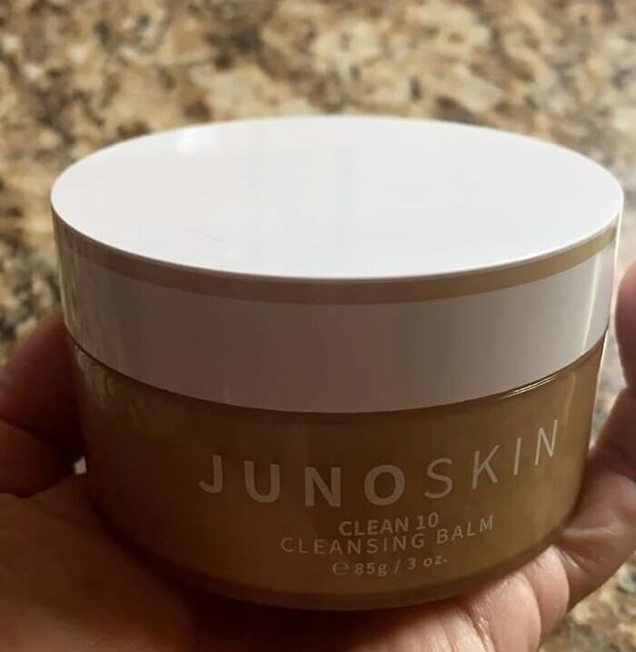 JunoSkin cleansing balm held in hand on a countertop, a perfect last-minute Christmas gift on Amazon Prime.