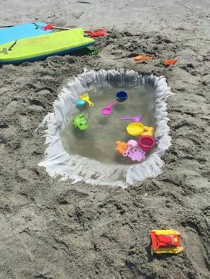 Use A Cheap Shower Curtain To Make A Little Pool For The Kids At The Beach