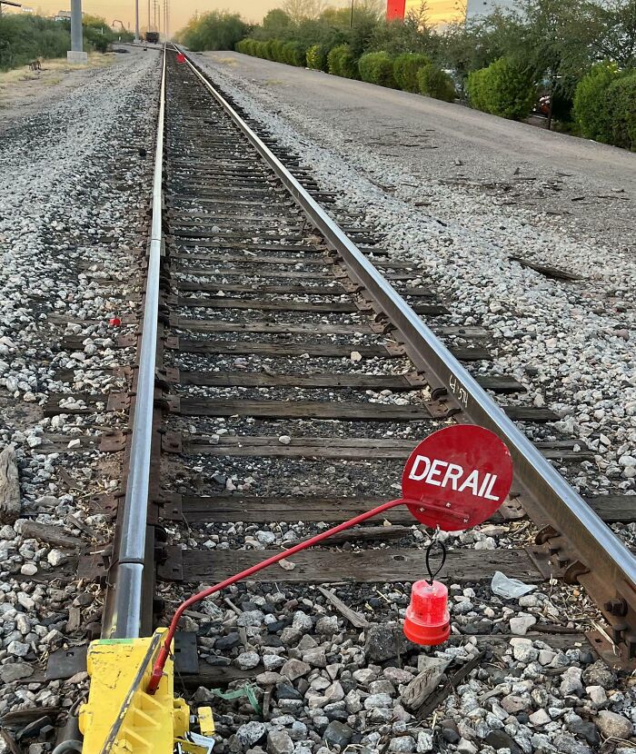 Railway track with a red derail sign, creating a mildly interesting scene.