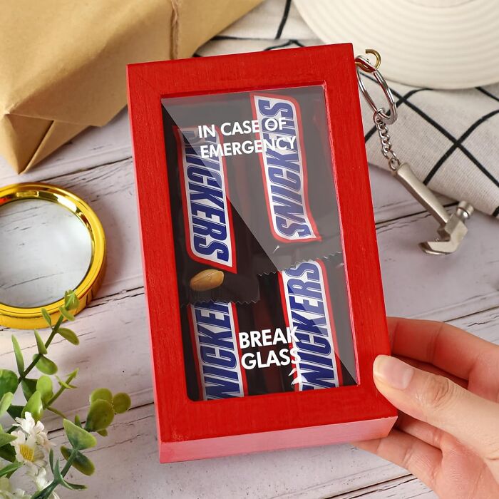 Red gift box with Snickers bars inside labeled "In Case of Emergency, Break Glass," ideal for white elephant gifts.