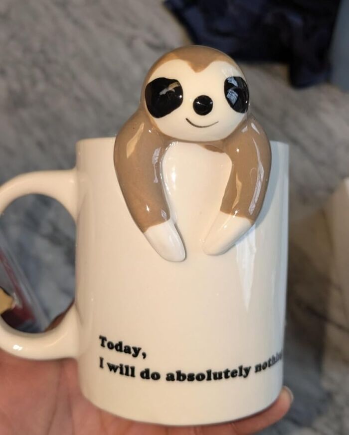 Ceramic mug with a sloth design, perfect for White Elephant gifts.