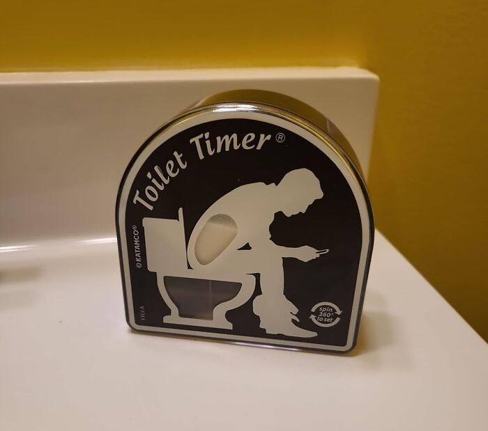 Toilet Timer novelty item, perfect for white elephant gifts, displayed on a bathroom shelf.