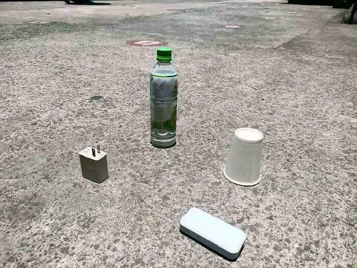 Objects on a concrete surface in bright sunlight, resembling a scene from a videogame.