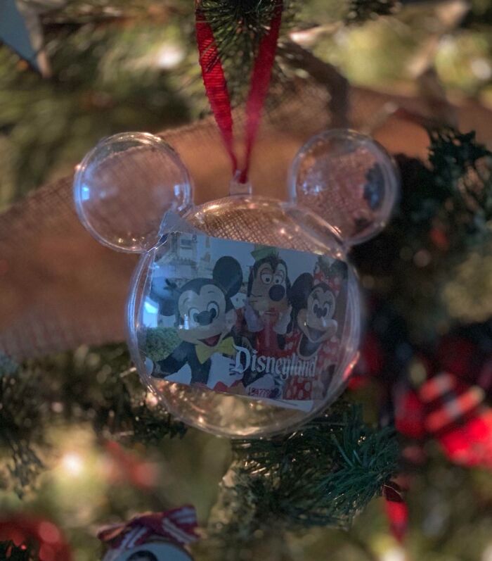 Disney-themed Christmas ornament on tree, capturing wholesome holiday spirit.