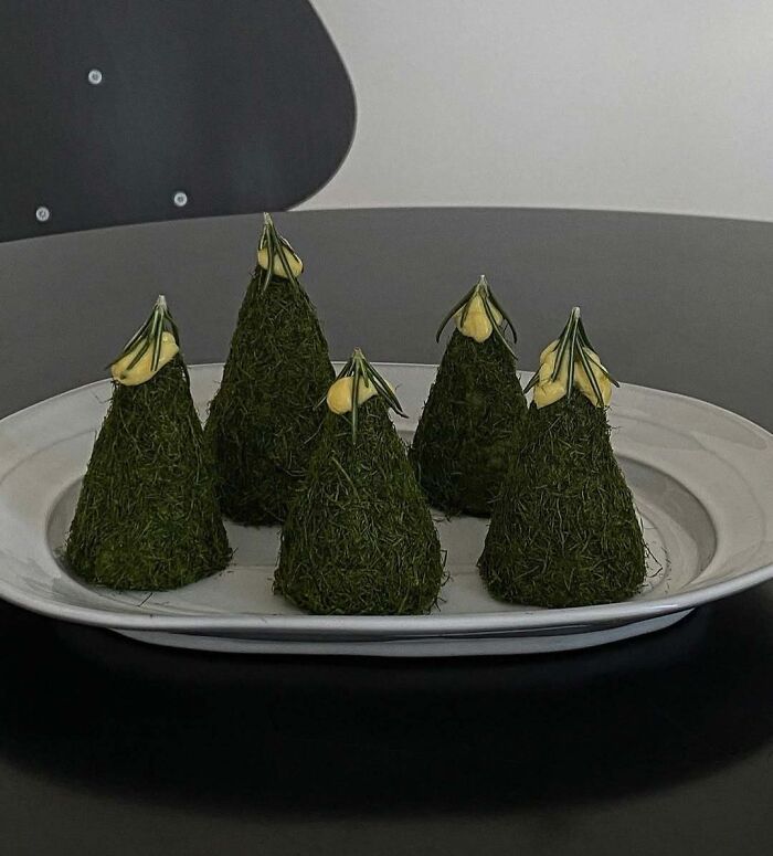 Christmas snack food ideas displayed as mini tree-shaped appetizers on a plate.