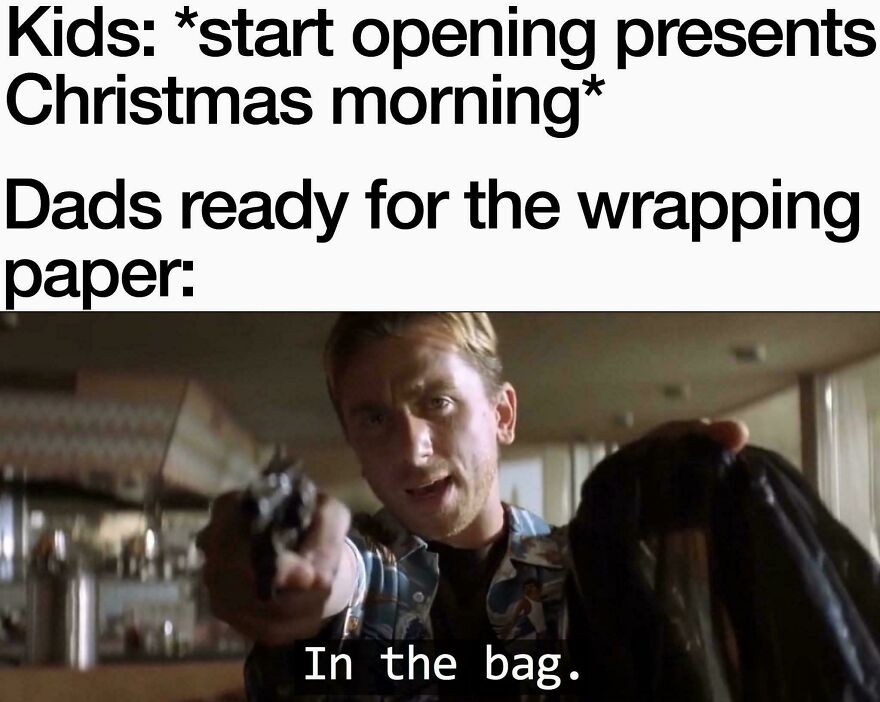 Dad humor captured in a funny Christmas meme showing a man collecting wrapping paper.