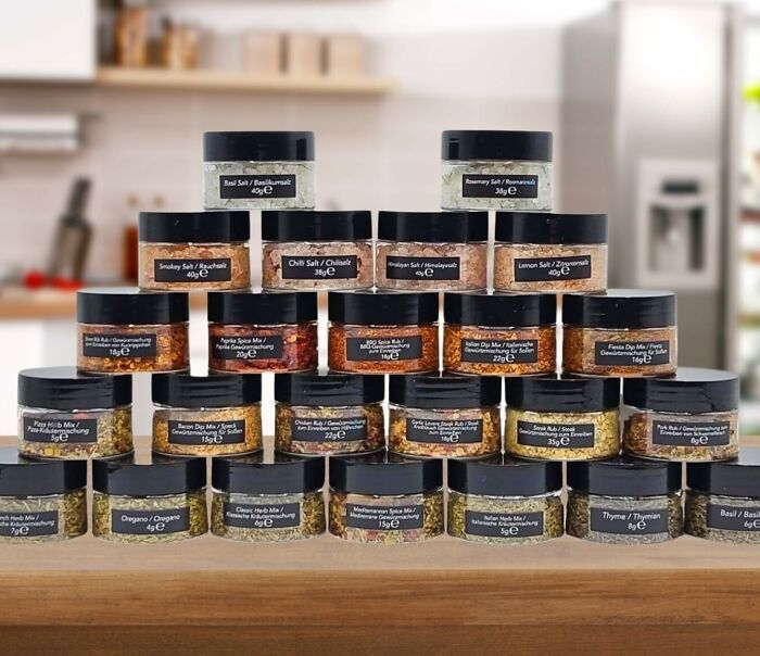 Stacked spice jars from a fun subscription box in a kitchen setting.