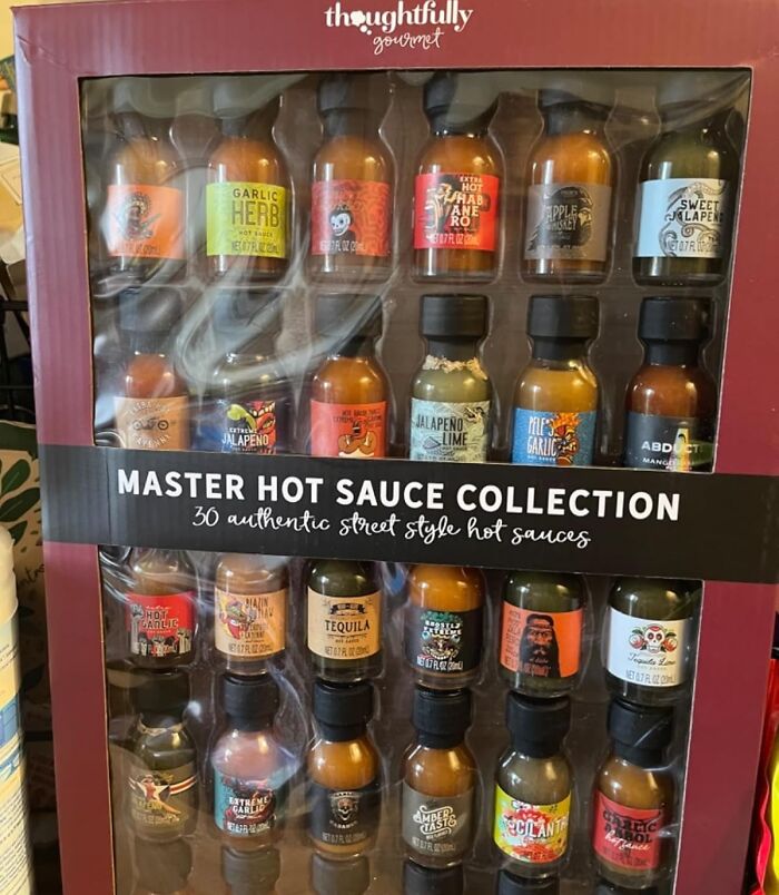 Subscription box featuring a Master Hot Sauce Collection with various flavors in colorful bottles.