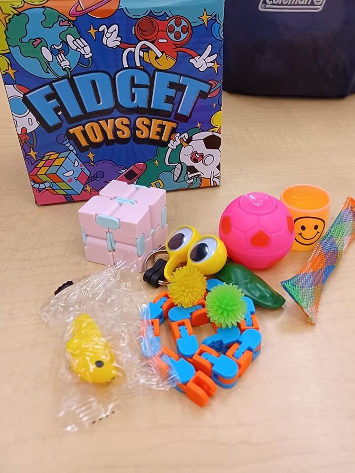 Fidget toys set from a fun subscription box featuring a variety of colorful items on a table.