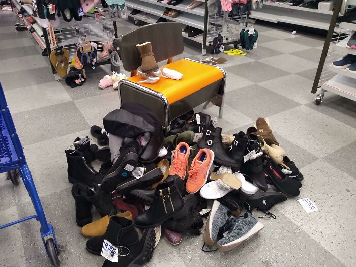 Messy pile of shoes around a store chair, demonstrating lazy-infuriating-people behavior.