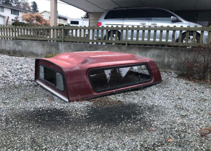 Truck cap appears to float above gravel, resembling a bad render in real life.