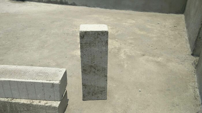 Concrete blocks on a flat surface appear unrealistic, resembling bad renders in real-life photos.