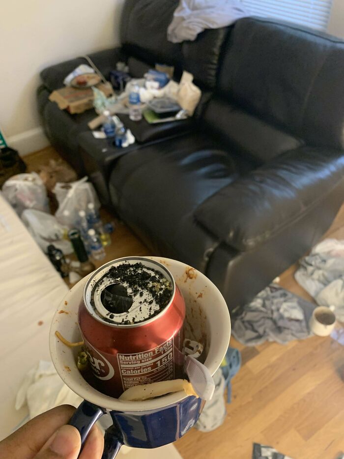 Messy living room with trash and food leftovers, illustrating horrible roommates scenario.