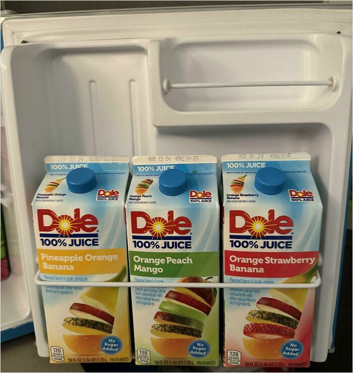 Juice cartons perfectly fit the fridge door shelf, showcasing a satisfying-perfect-fit arrangement.