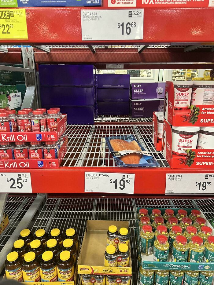 Empty shelf above fish oil display in store, illustrating lazy-infuriating-people behavior in stocking.