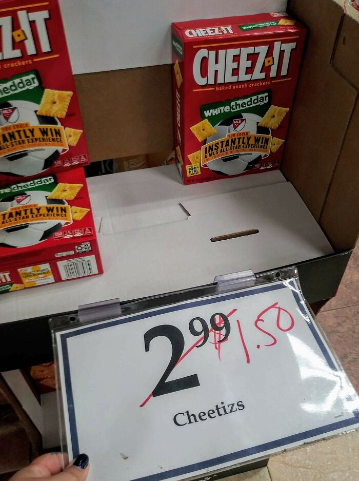 "Cheez-It boxes on display with mismatched label reading 'Cheetiz, $1.50'; showcasing lazy-infuriating-people moments."