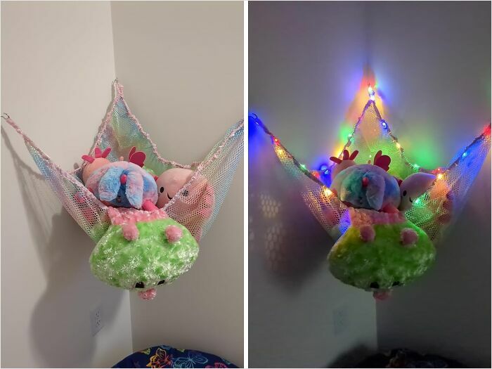 Stuffed animals organized in a wall hammock, enhanced by colorful lights.