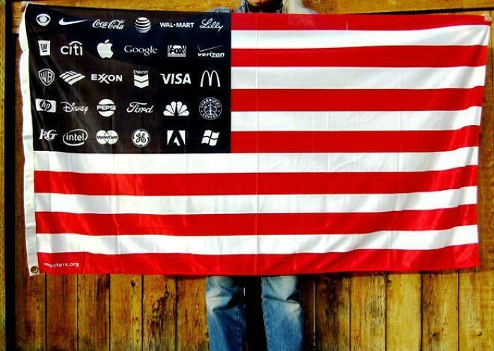 Flag with corporate logos suggesting boring dystopia, replacing stars on the U.S. flag.