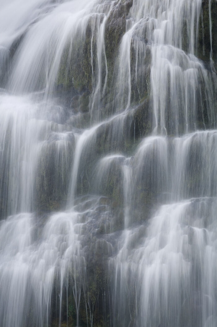 Photographer captures cascading waterfall, creating a mesmerizing wave-like effect.