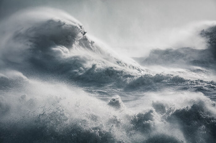 Dynamic waves captured in stunning detail by photographer, showcasing nature's power and beauty.