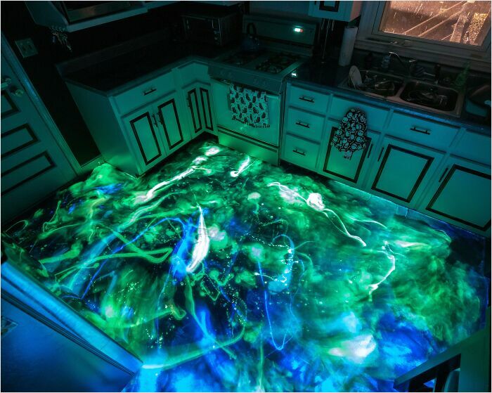 Kitchen floor with glowing green and blue lights, resembling a scene from a videogame.