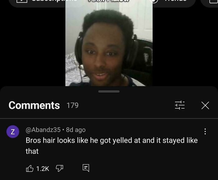 Person wearing headphones with funny roast about their hair in comment below.