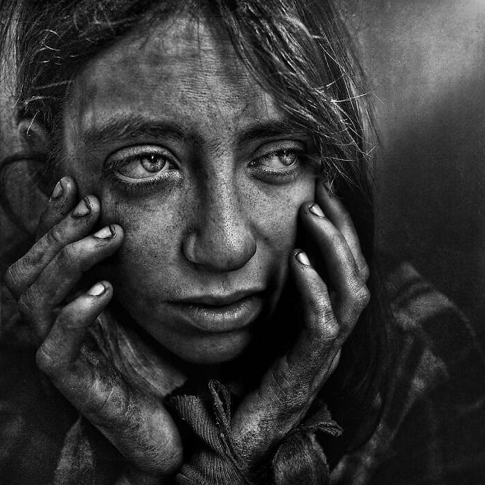 Soulful portrait of a person with intense expression, captured by photographer Lee Jeffries.