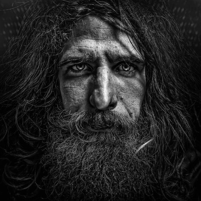 Soulful black and white portrait of a bearded man by Lee Jeffries.