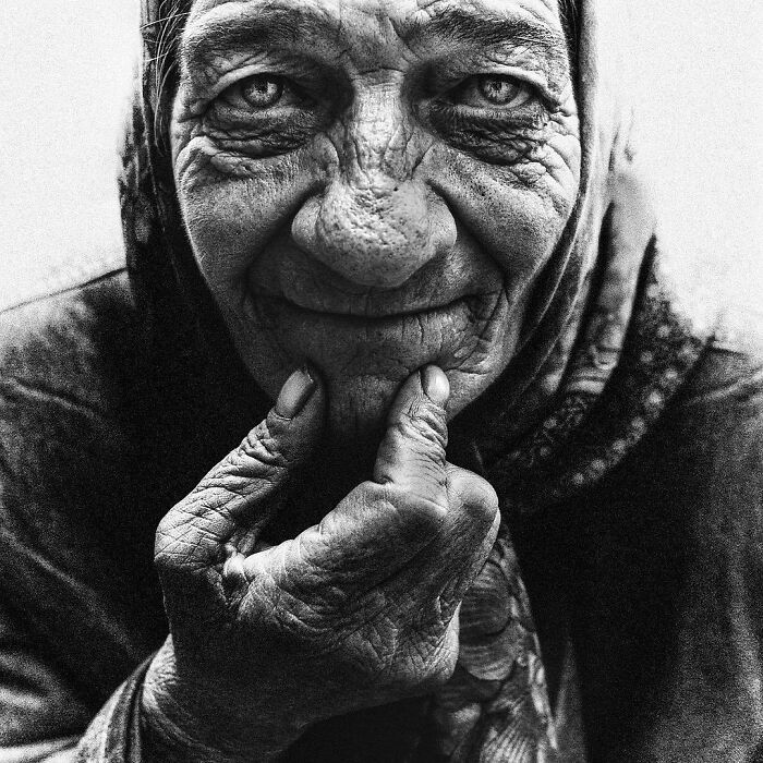 A soulful portrait of an elderly person with detailed facial lines, captured by Lee Jeffries.