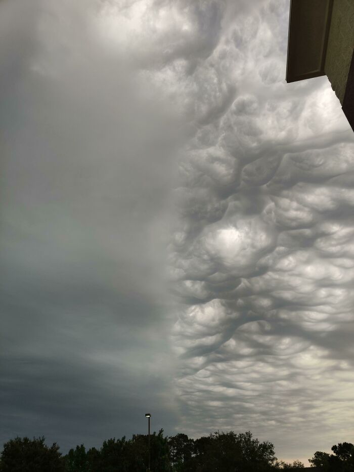 Cloud formations in the sky resembling computer-generated renders, creating a surreal visual effect.