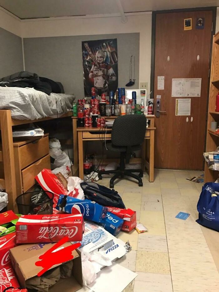 Messy dorm room with empty soda cans and food boxes, illustrating the challenges of horrible roommates.