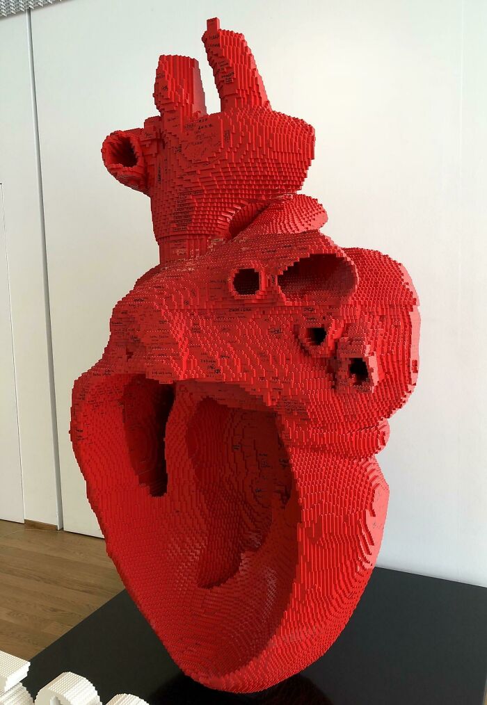 Heart sculpture made of red LEGO bricks, demonstrating cool LEGO builds creativity and artistry.