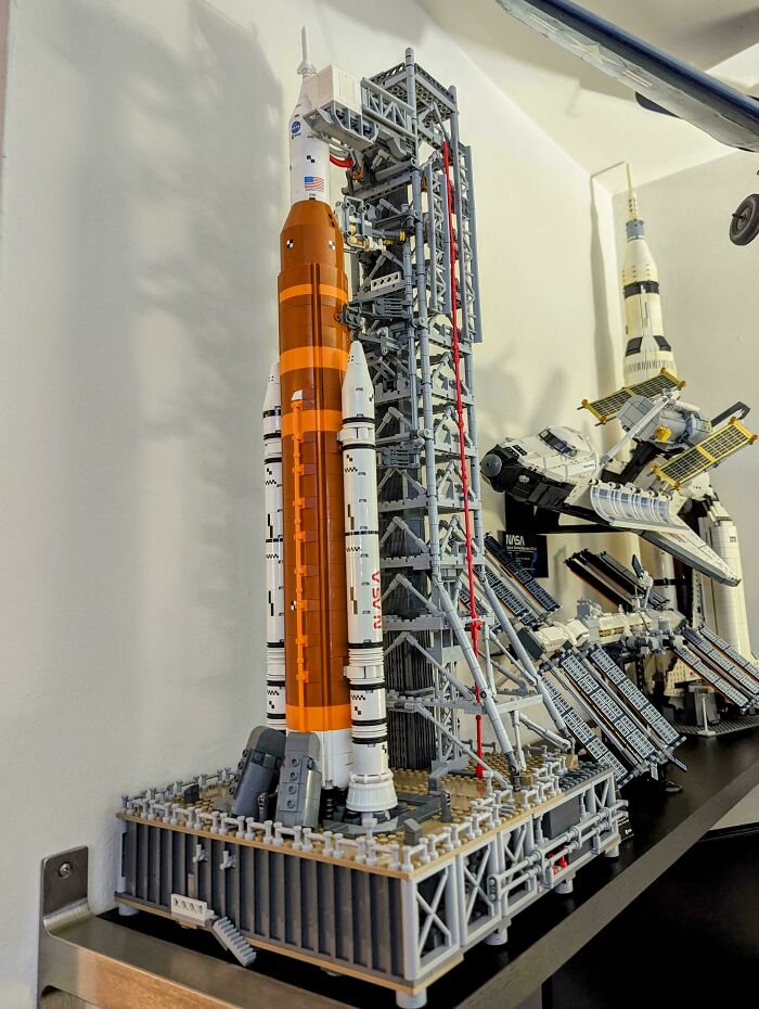 LEGO rocket and launch tower display on a shelf, showcasing cool LEGO builds.