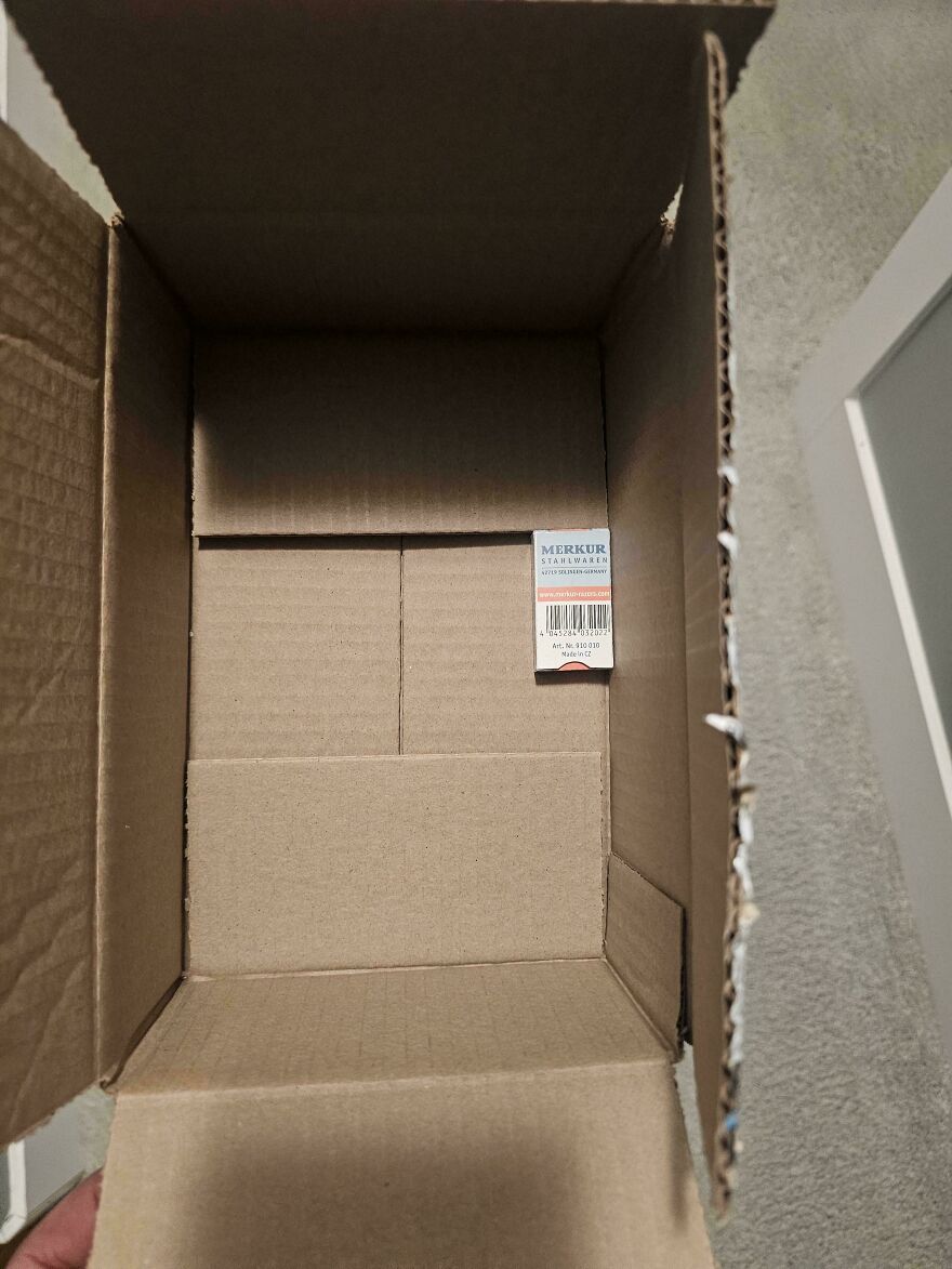 Oversized cardboard box with wasteful unnecessary packaging for a small item.