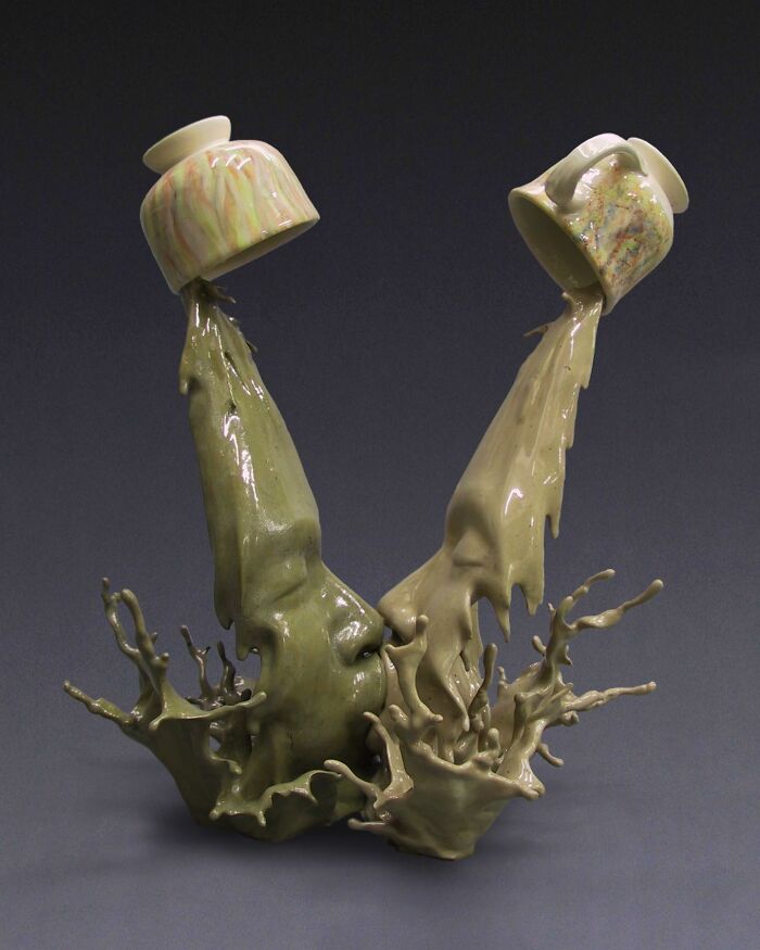 Realism and surrealism blend in expressive sculpture of cups with fluid forms.