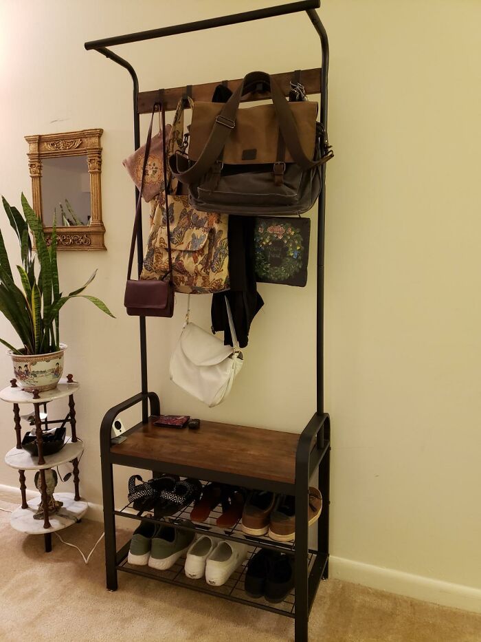 Metal hall tree with a bench, hooks for bags, and a shoe rack; highly rated Amazon furniture.